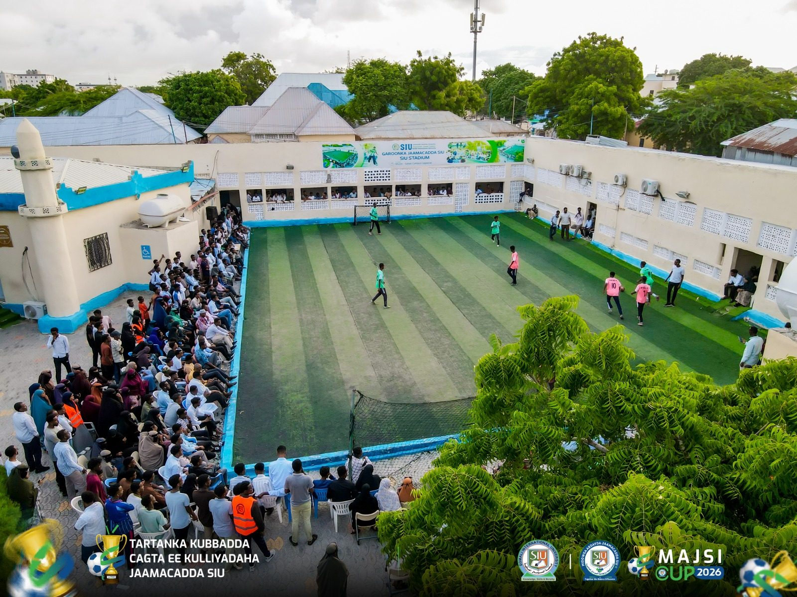 Aerial view of the SIU Stadium during the Inter-Faculty Sports Competition, with students playing and spectators filling the stands